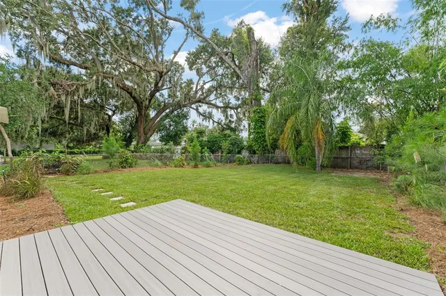 a view of a wooden deck and garden