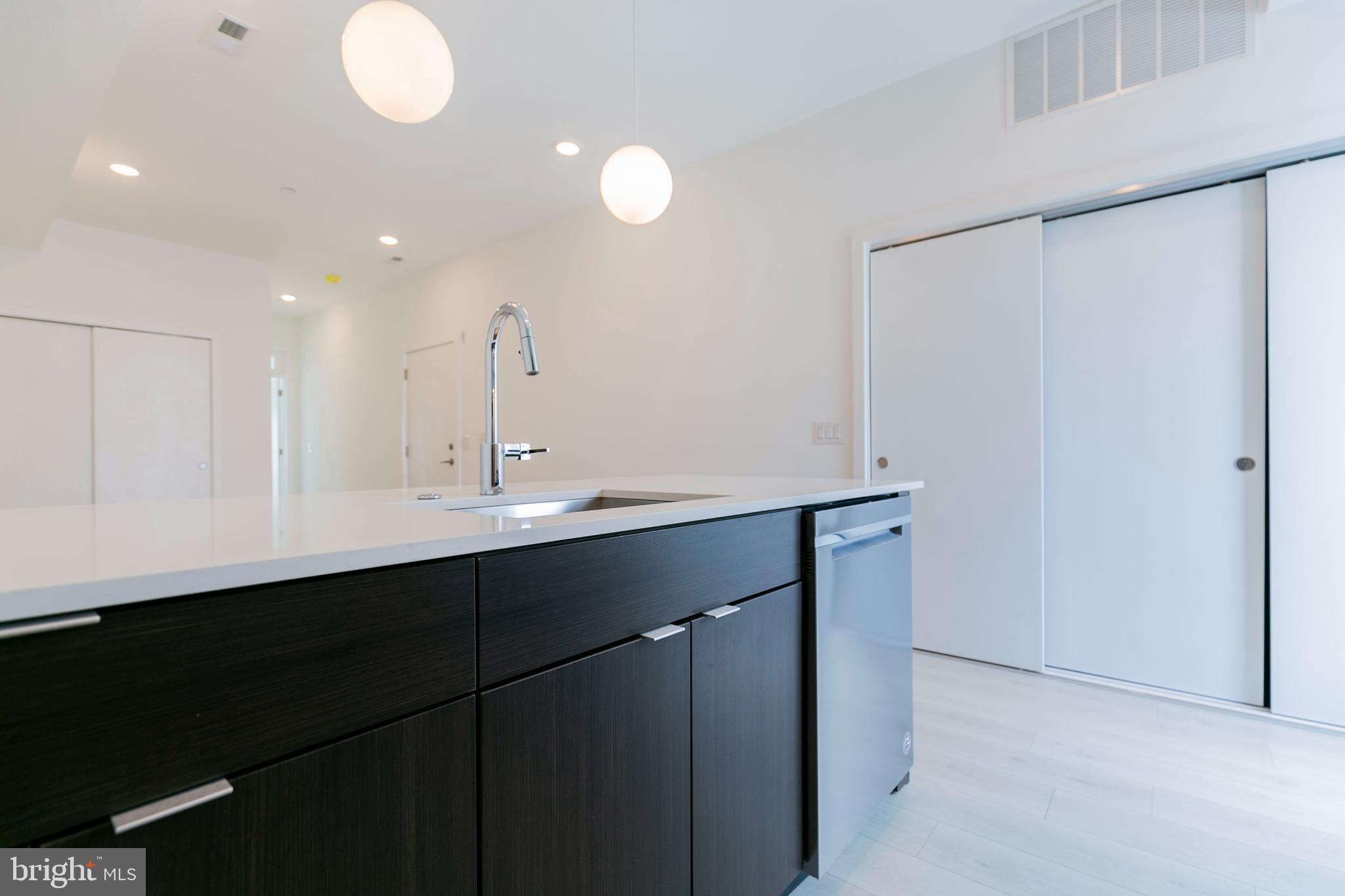 1242 LeCount Street, Unit B Philadelphia, PA 19121 - Photo 4 of 11 a bathroom with a sink and mirror