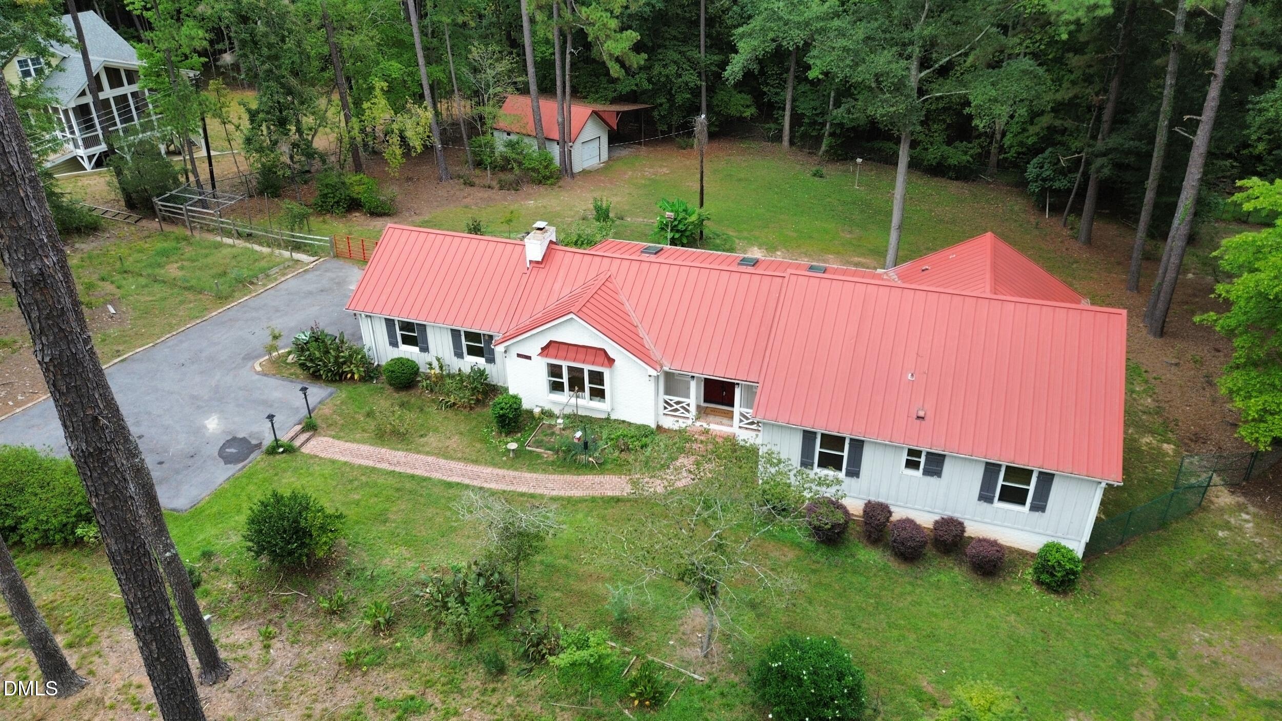 2329 Win Road Garner, NC 27529 - Photo 85 of 90 White exterior with a vibrant red metal roof