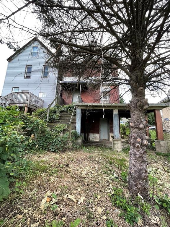 805 Oak Street Duquesne, PA 15110 - Photo 15 of 15 a front view of a house with a garden