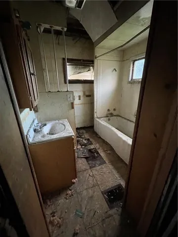 a room with water heater and a cabinet