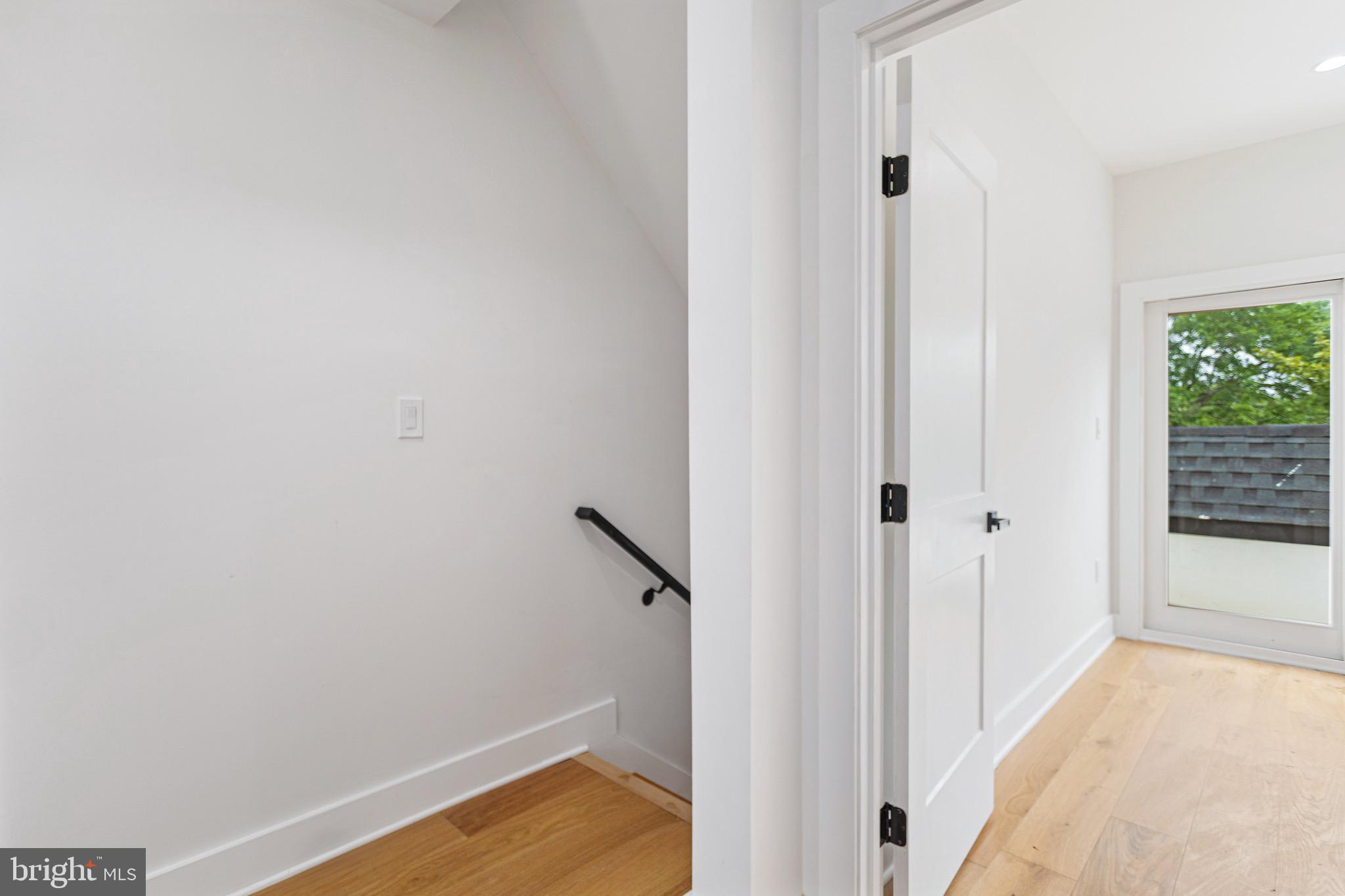 1107 Queen Street Northeast, Unit PH4 Washington, DC 20002 - Photo 21 of 28 a view of a room with wooden floor and entryway