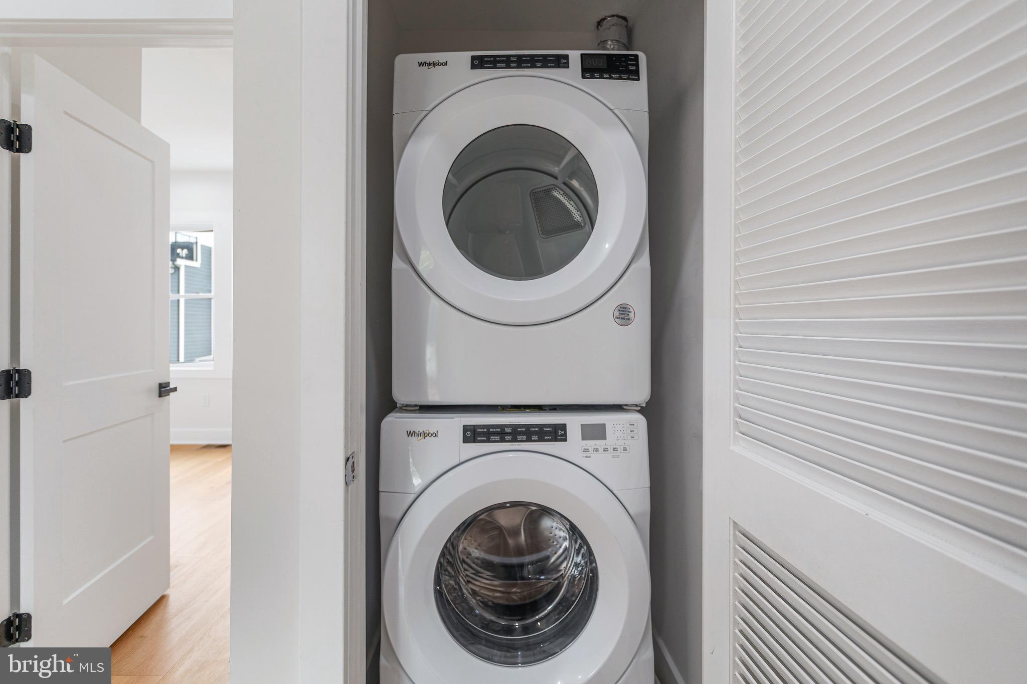 1107 Queen Street Northeast, Unit PH4 Washington, DC 20002 - Photo 22 of 28 a utility room with dryer and washer