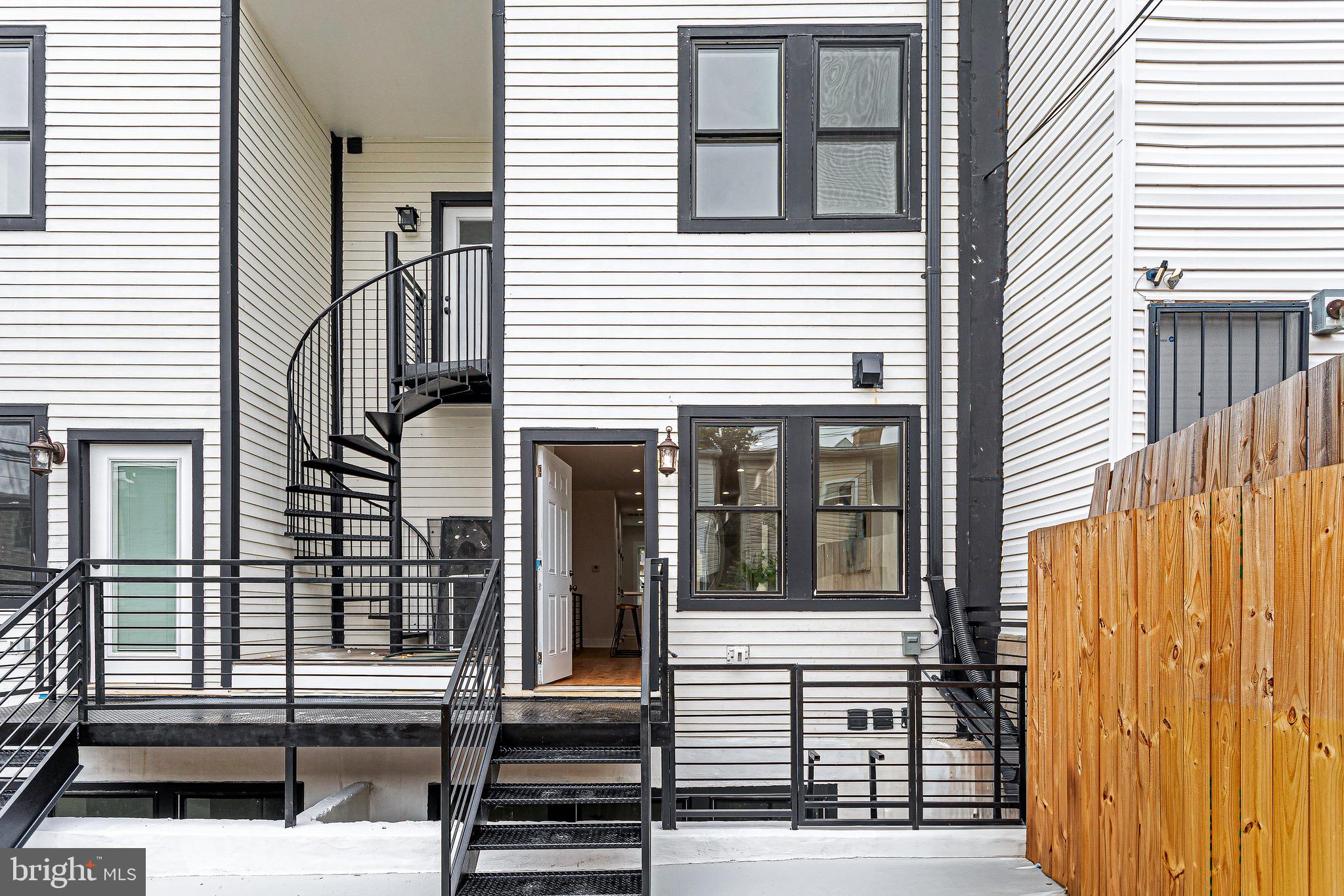 1107 Queen Street Northeast, Unit PH4 Washington, DC 20002 - Photo 27 of 28 a view of a house with a door and a window