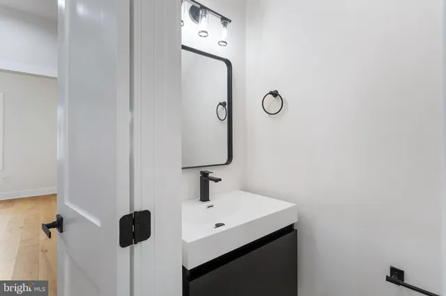 a bathroom with a sink and mirror