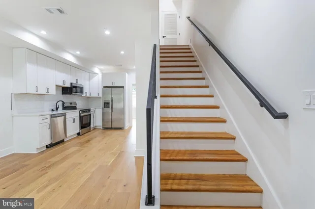 a view of kitchen with sink microwave and stove