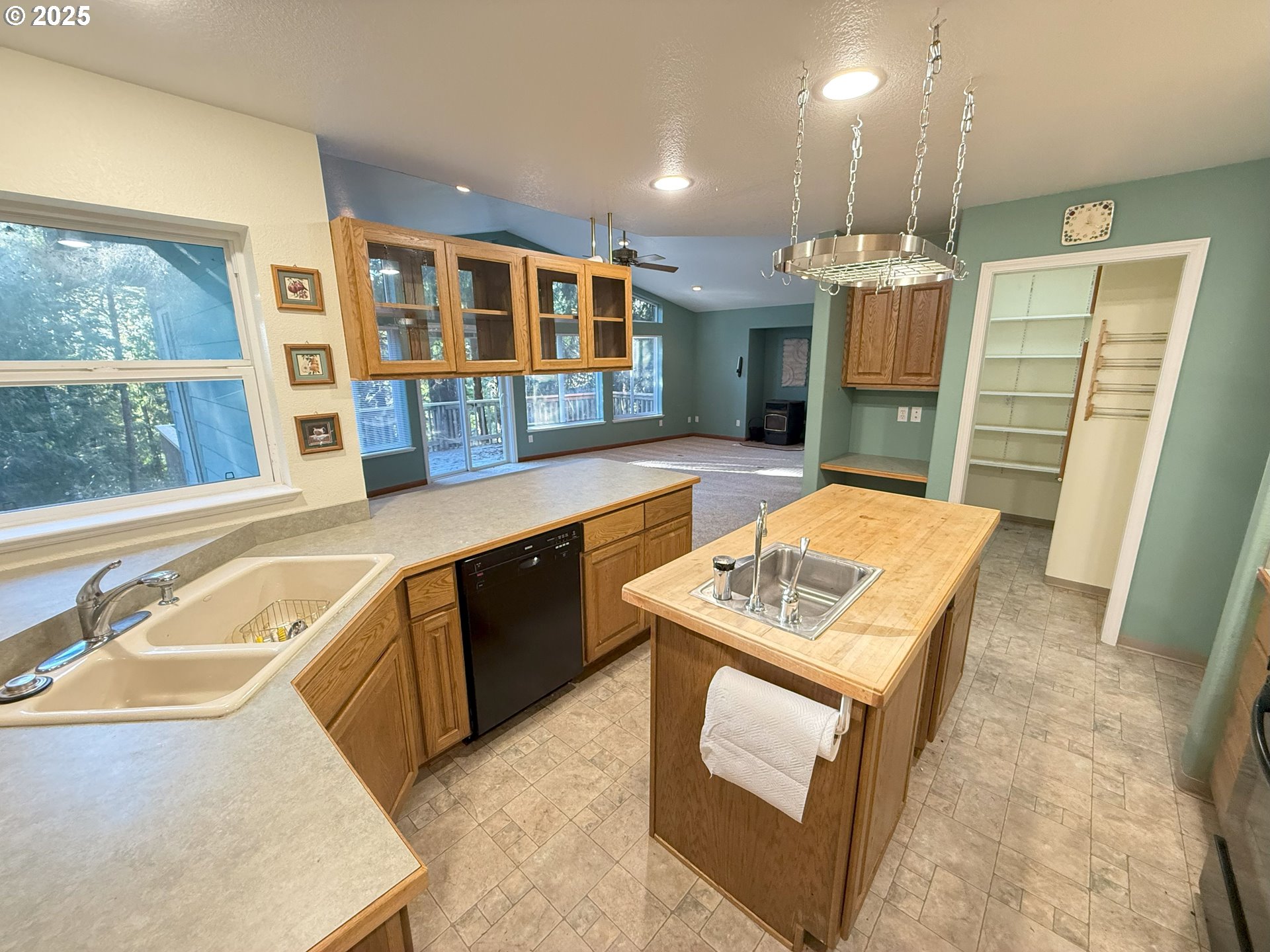 5938 View Loop Florence, OR 97439 - Photo 14 of 42 a kitchen with stainless steel appliances granite countertop a sink stove and refrigerator