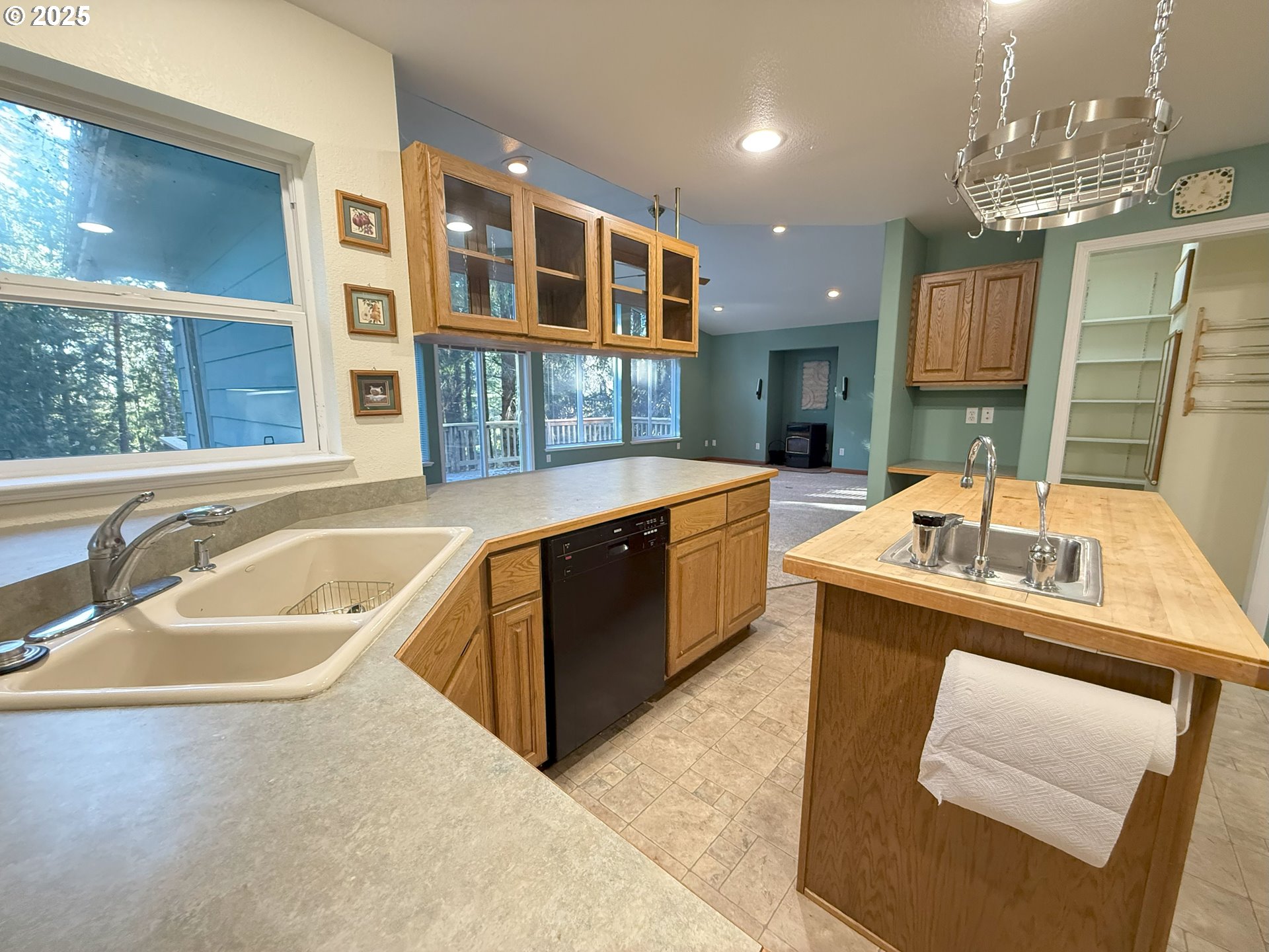 5938 View Loop Florence, OR 97439 - Photo 15 of 42 a bathroom with a tub sink and mirror
