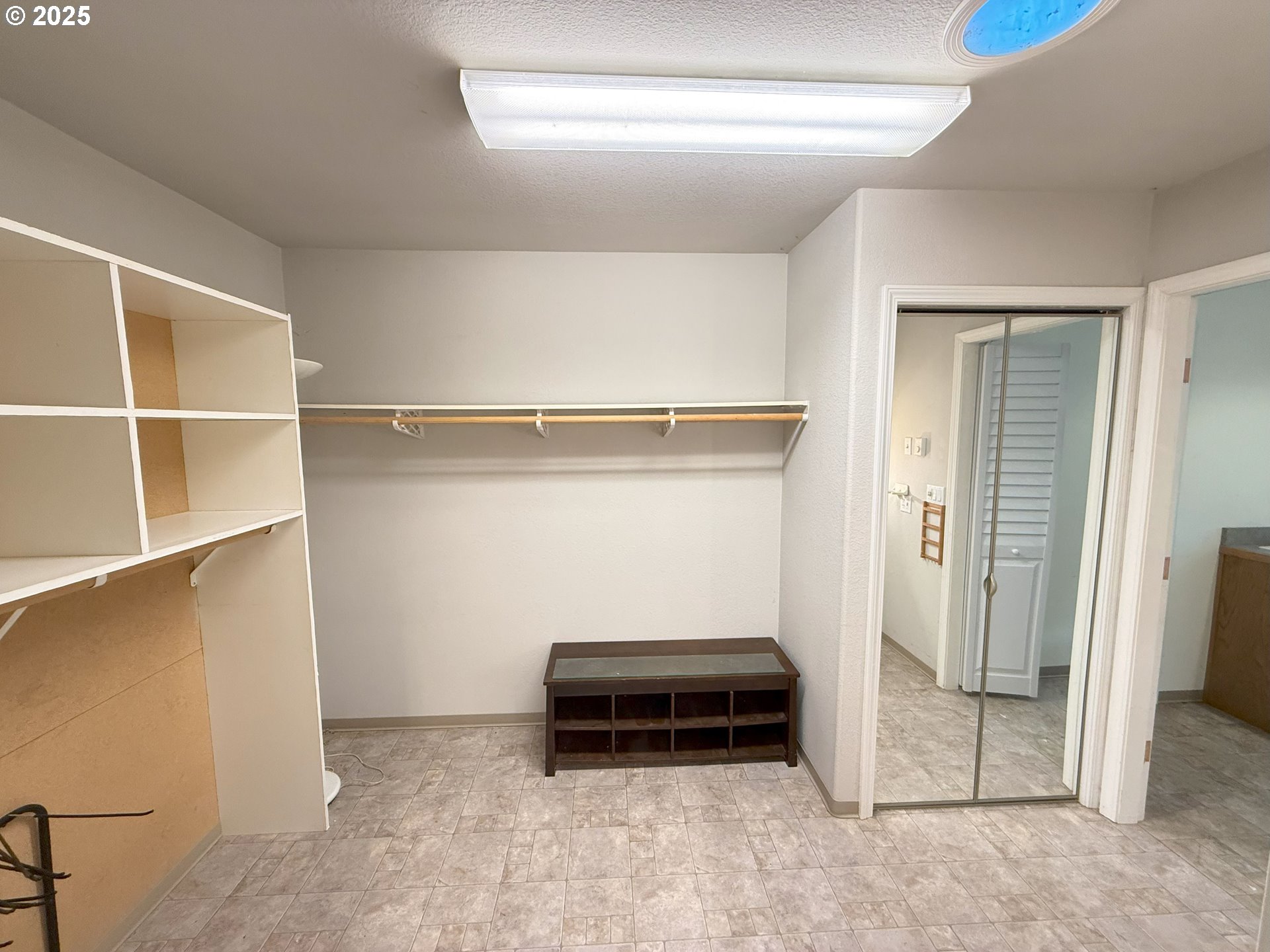 5938 View Loop Florence, OR 97439 - Photo 22 of 42 a view of walk in closet with empty racks