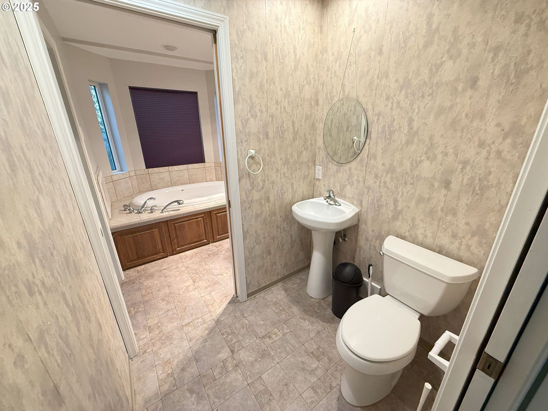 5938 View Loop Florence, OR 97439 - Photo 23 of 42 a bathroom with a sink toilet and a mirror