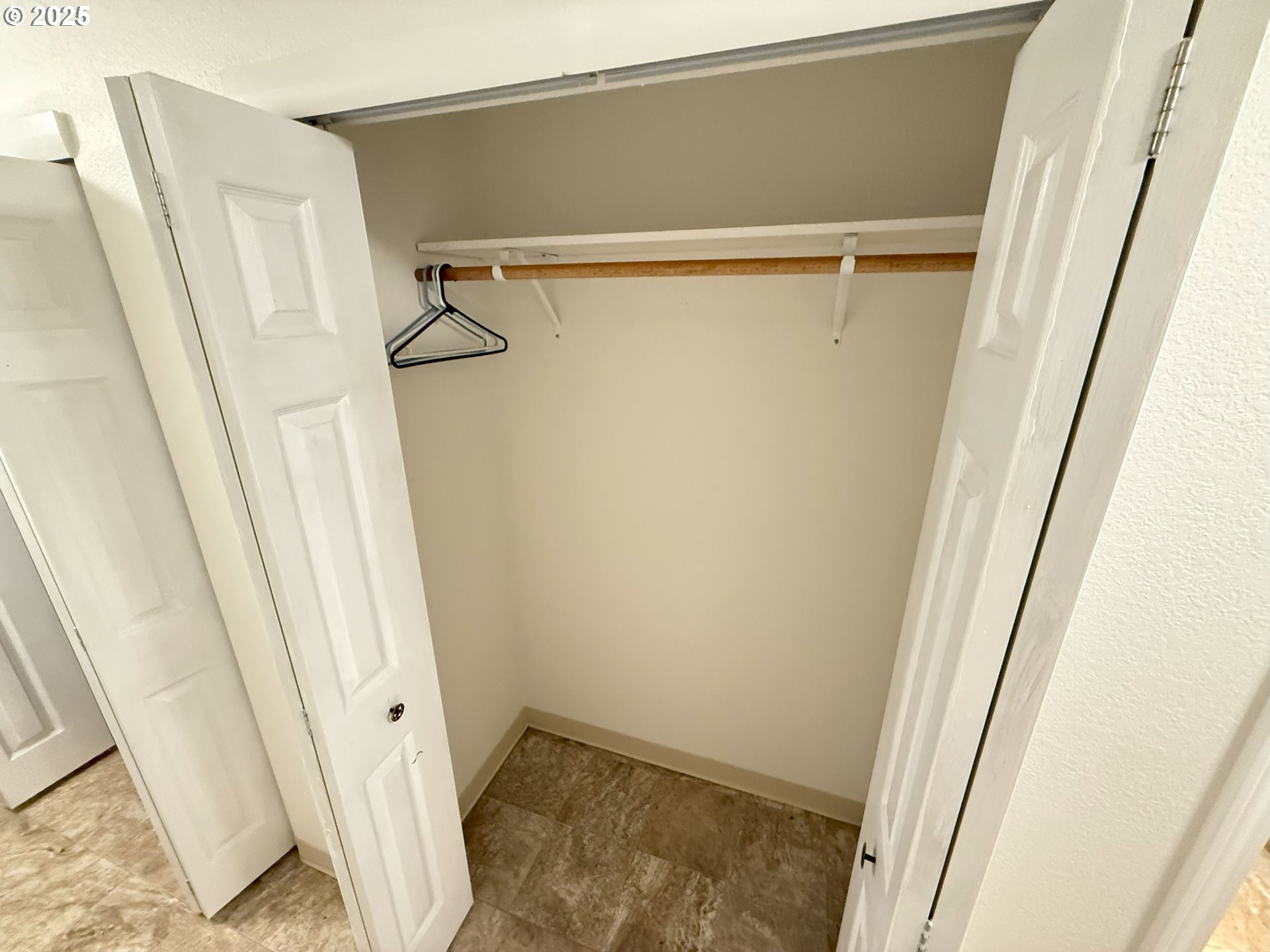 5938 View Loop Florence, OR 97439 - Photo 31 of 42 a view of closet with wooden floor