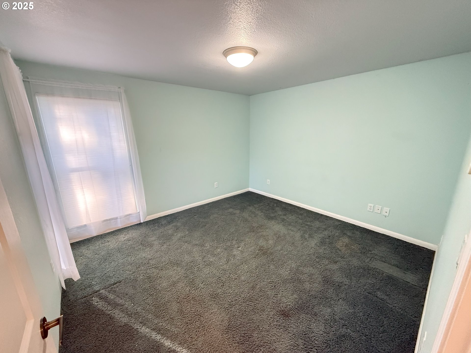5938 View Loop Florence, OR 97439 - Photo 32 of 42 an empty room with a natural light