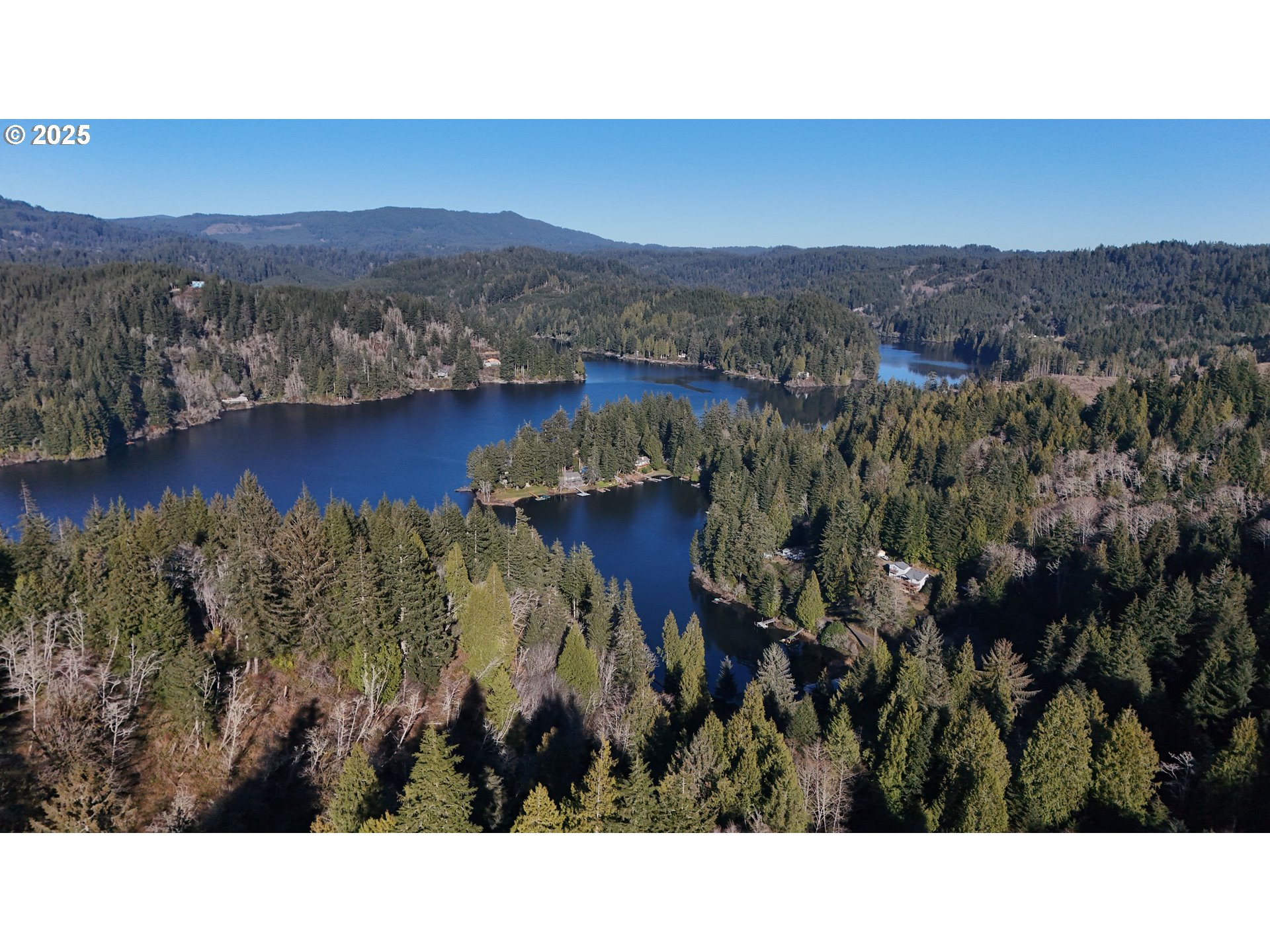 5938 View Loop Florence, OR 97439 - Photo 36 of 42 a black and white photo of a lake