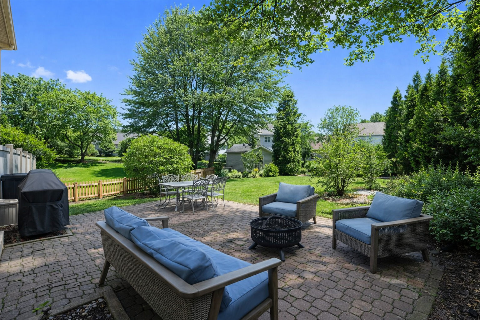 1506 Division Street St. Charles, IL 60174 - Photo 13 of 32 a view of a patio with table and chairs potted plants and a large tree