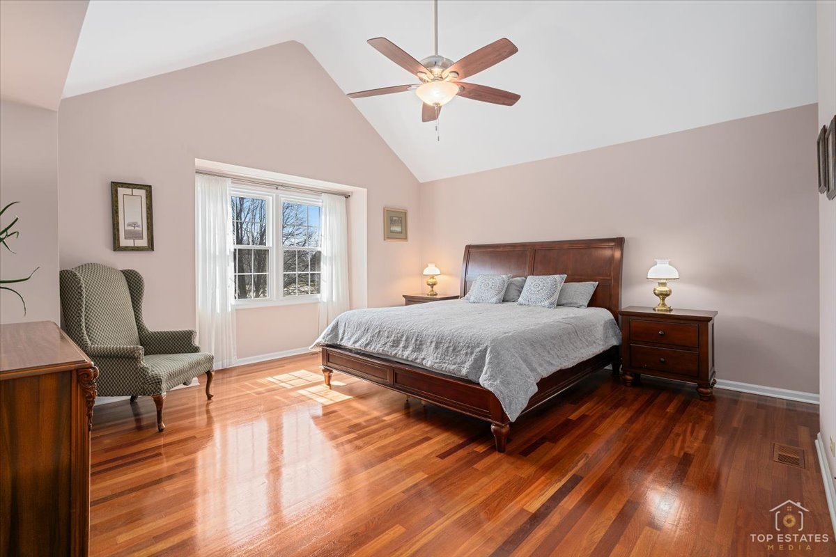 1506 Division Street St. Charles, IL 60174 - Photo 22 of 32 a bedroom with a bed a table and chair