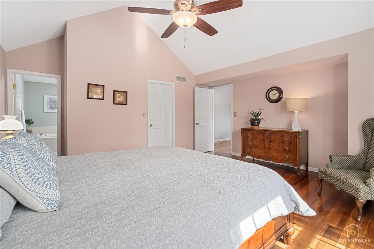 1506 Division Street St. Charles, IL 60174 - Photo 23 of 32 a bedroom with a bed and a chandelier