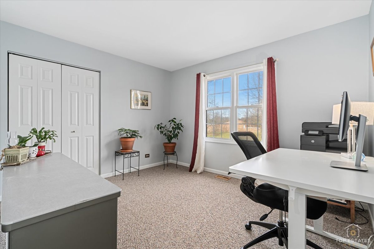 1506 Division Street St. Charles, IL 60174 - Photo 26 of 32 a view of a workspace with furniture and a potted plant