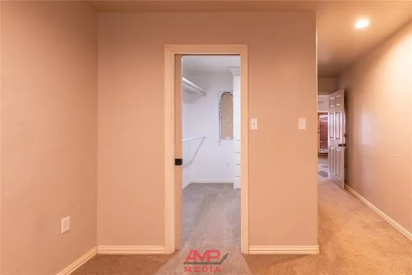 view of a hallway with wooden floor