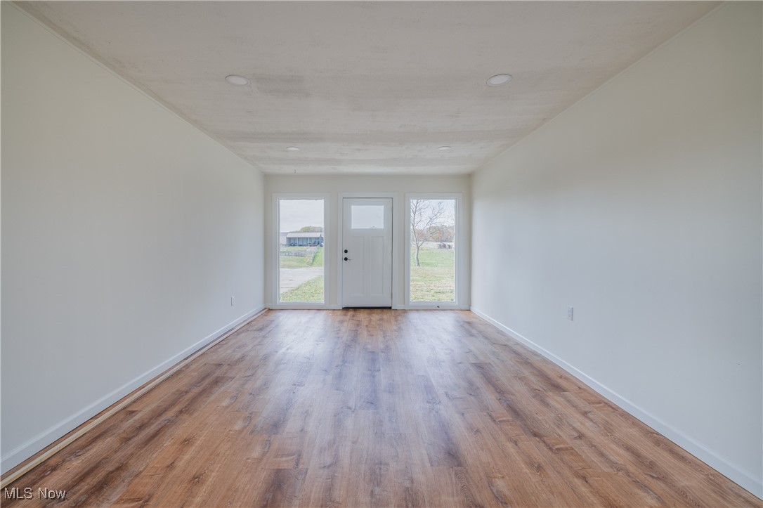 24534 Mill Road Utica, OH 43080 - Photo 21 of 38 Empty room featuring light wood-type flooring and recessed lighting