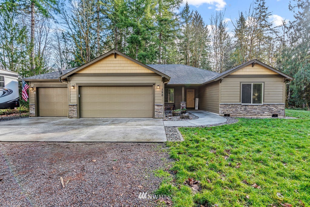 150 Cornell Road Toutle, WA 98649 - Photo 1 of 31 a front view of house with yard and green space