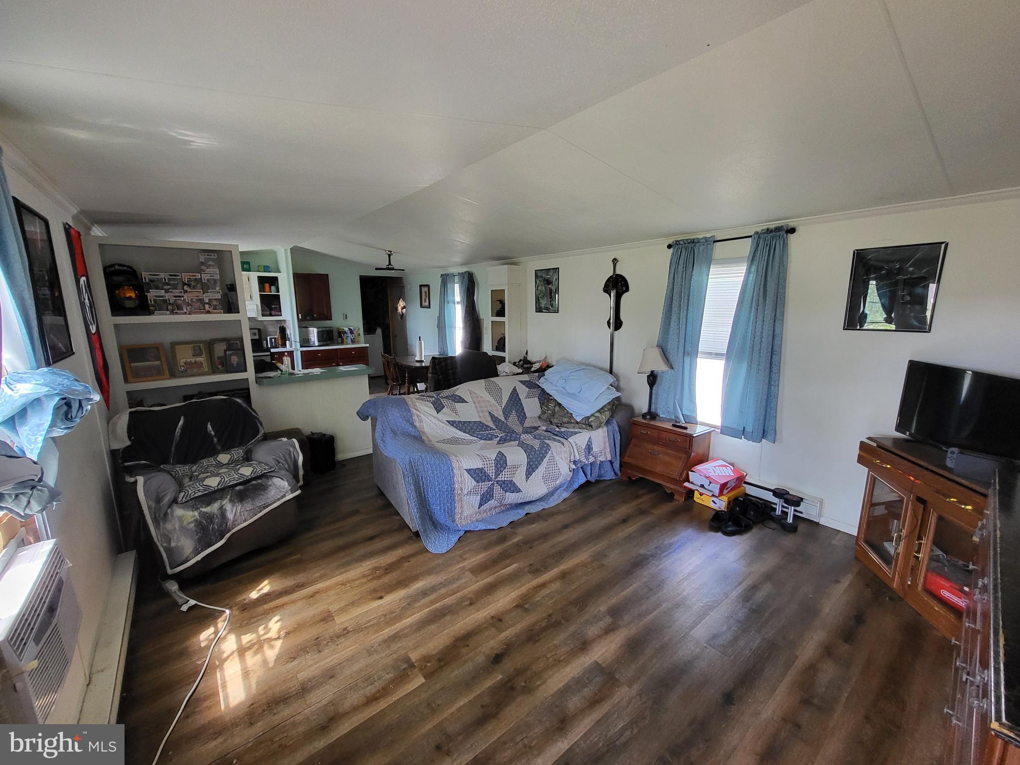 1859 Leafmore Road Chambersburg, PA 17202 - Photo 21 of 24 a bedroom with furniture and a flat screen tv