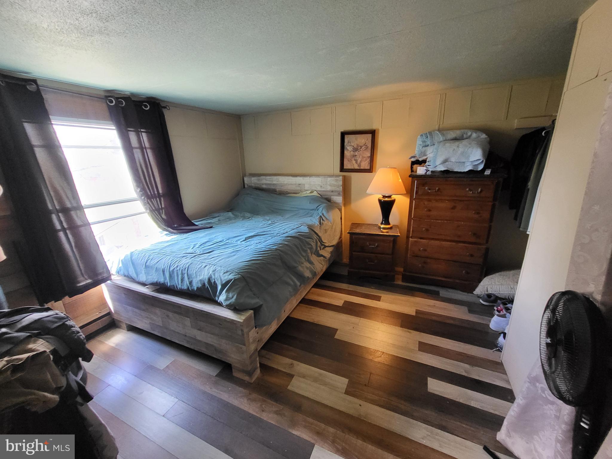 1859 Leafmore Road Chambersburg, PA 17202 - Photo 22 of 24 a bedroom with bed and wooden floor