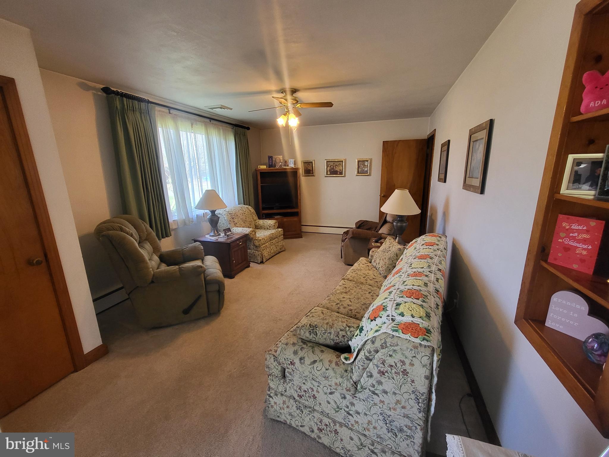 1859 Leafmore Road Chambersburg, PA 17202 - Photo 4 of 24 a living room with furniture and a flat screen tv