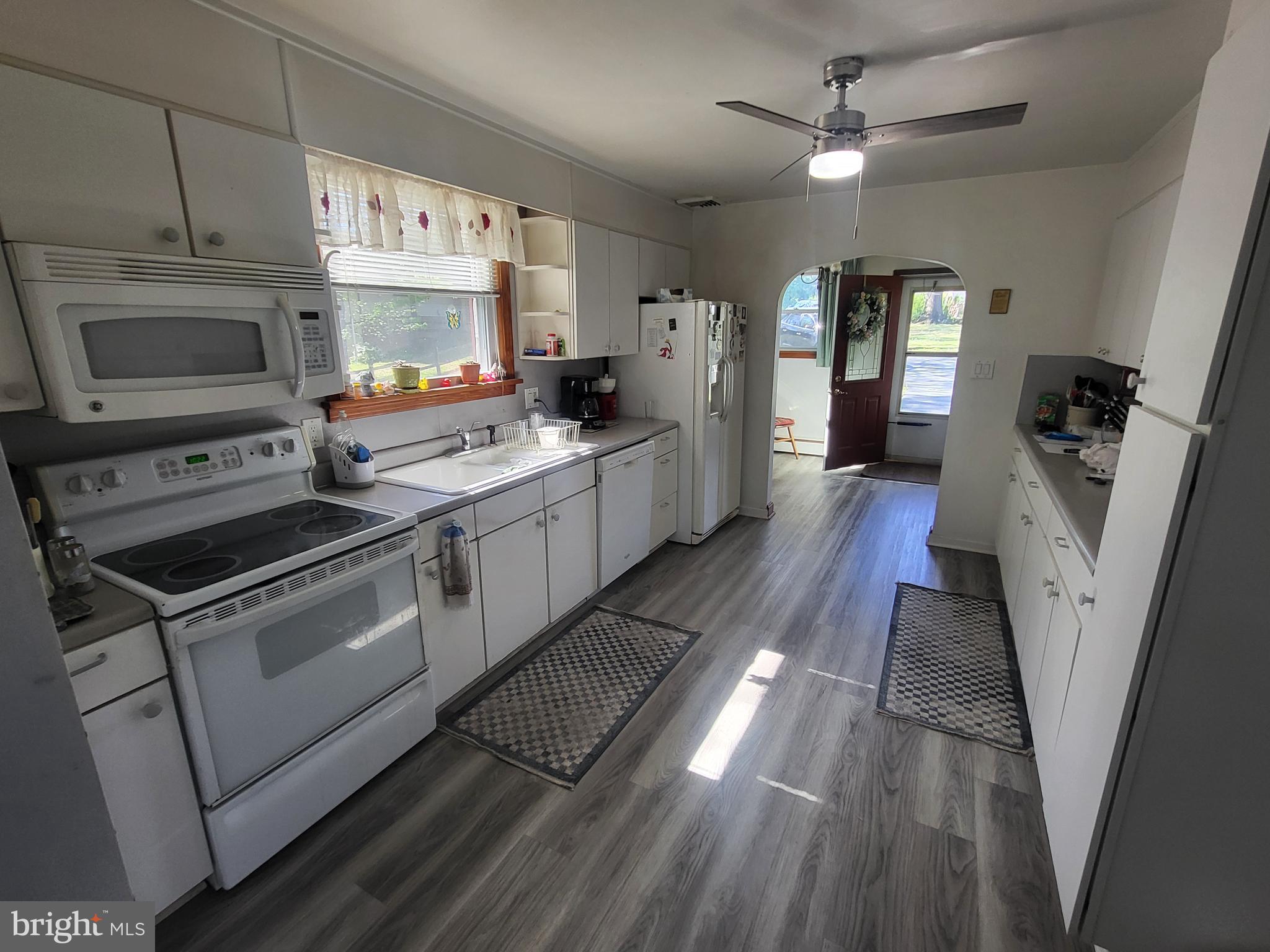 1859 Leafmore Road Chambersburg, PA 17202 - Photo 5 of 24 a kitchen with stainless steel appliances a stove a sink and a refrigerator