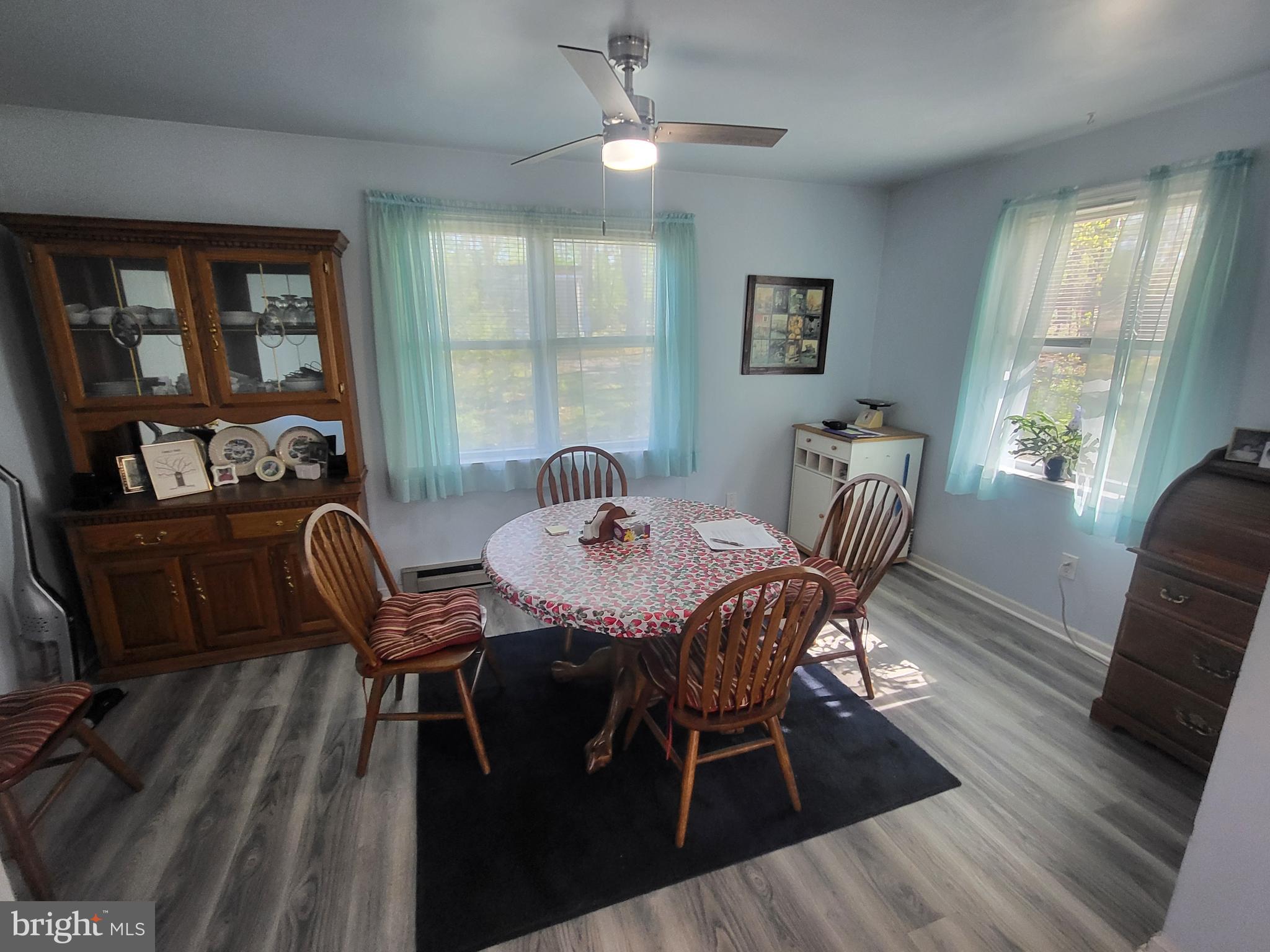 1859 Leafmore Road Chambersburg, PA 17202 - Photo 6 of 24 a view of a dining room with furniture window and wooden floor