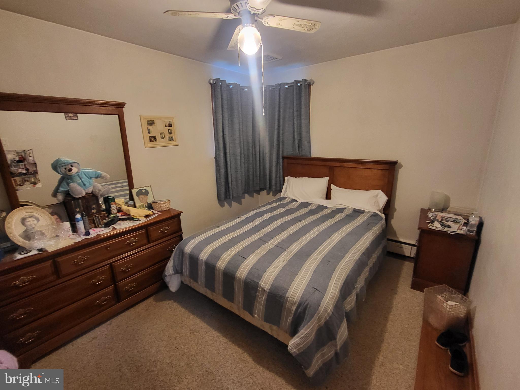 1859 Leafmore Road Chambersburg, PA 17202 - Photo 7 of 24 a bedroom with a bed and wooden floor