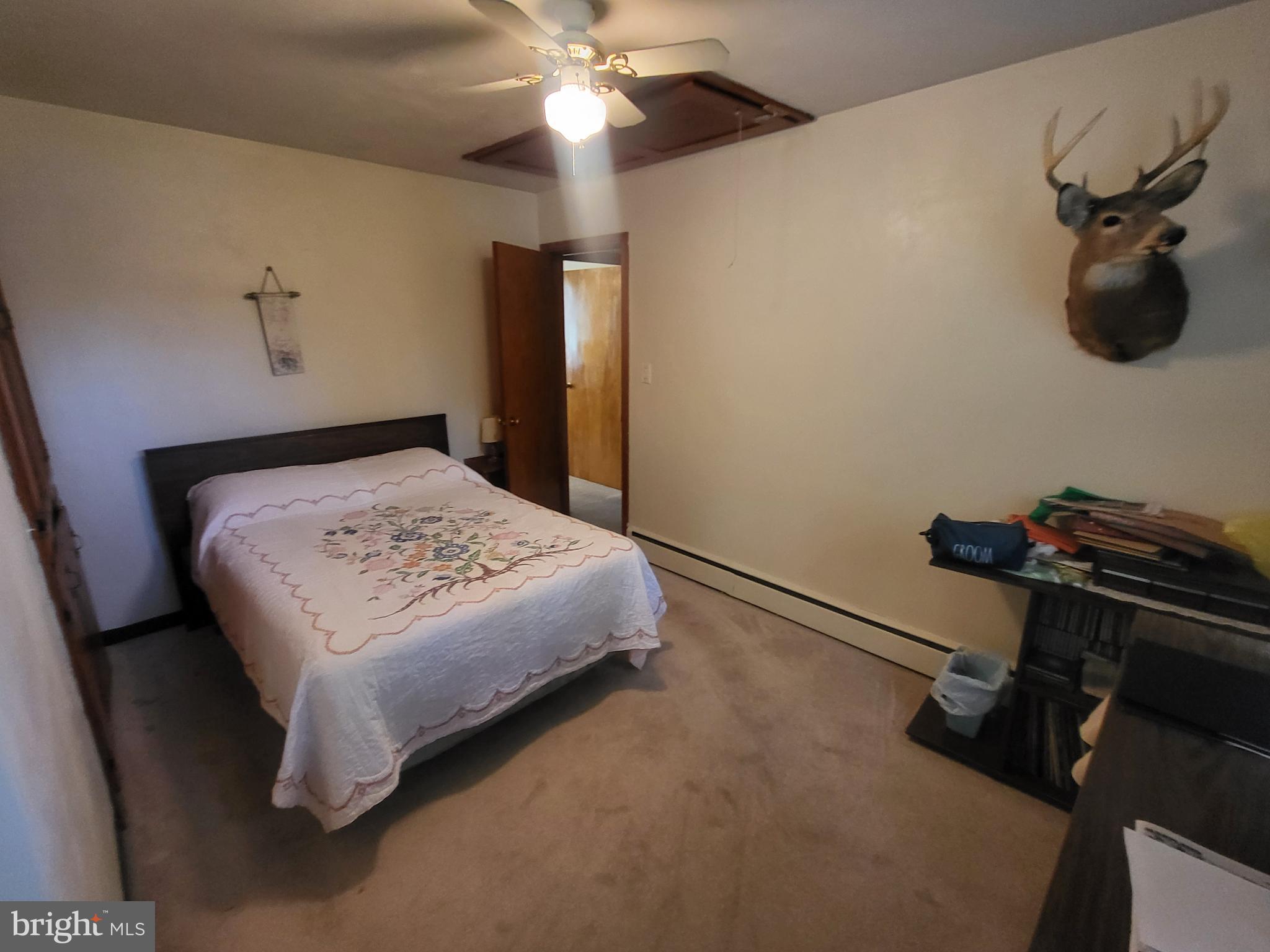1859 Leafmore Road Chambersburg, PA 17202 - Photo 8 of 24 a bedroom with a bed and a chandelier