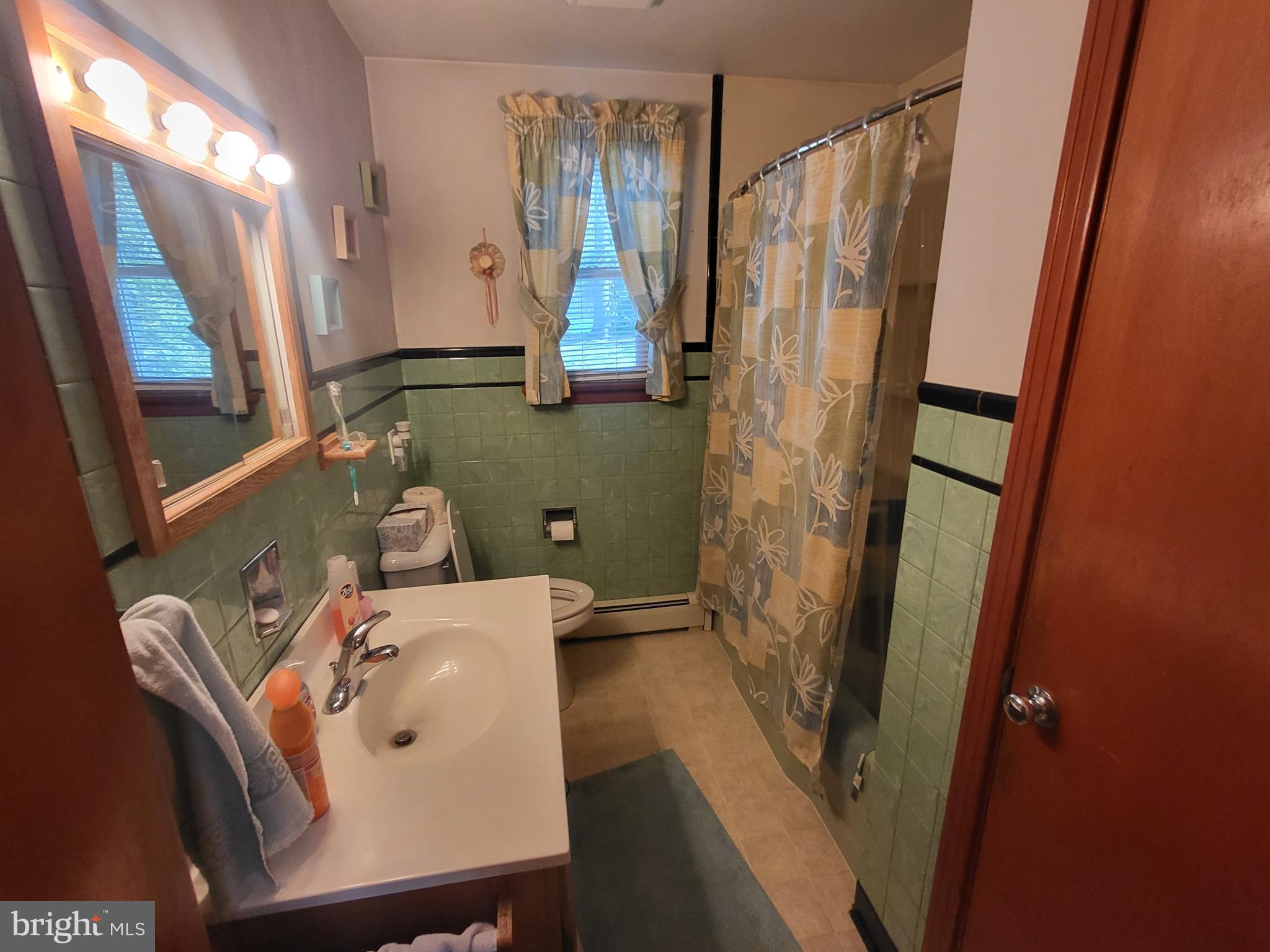 1859 Leafmore Road Chambersburg, PA 17202 - Photo 9 of 24 a bathroom with a sink a mirror and a shower