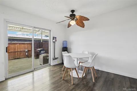 a view of a dining room with furniture wooden floor and chandelier