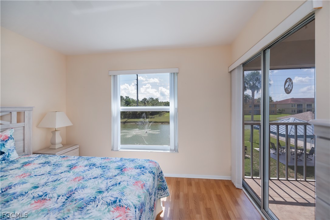 1100 Pondella Road, Unit 514 Cape Coral, FL 33909 - Photo 20 of 34 a bedroom with a bed and a window