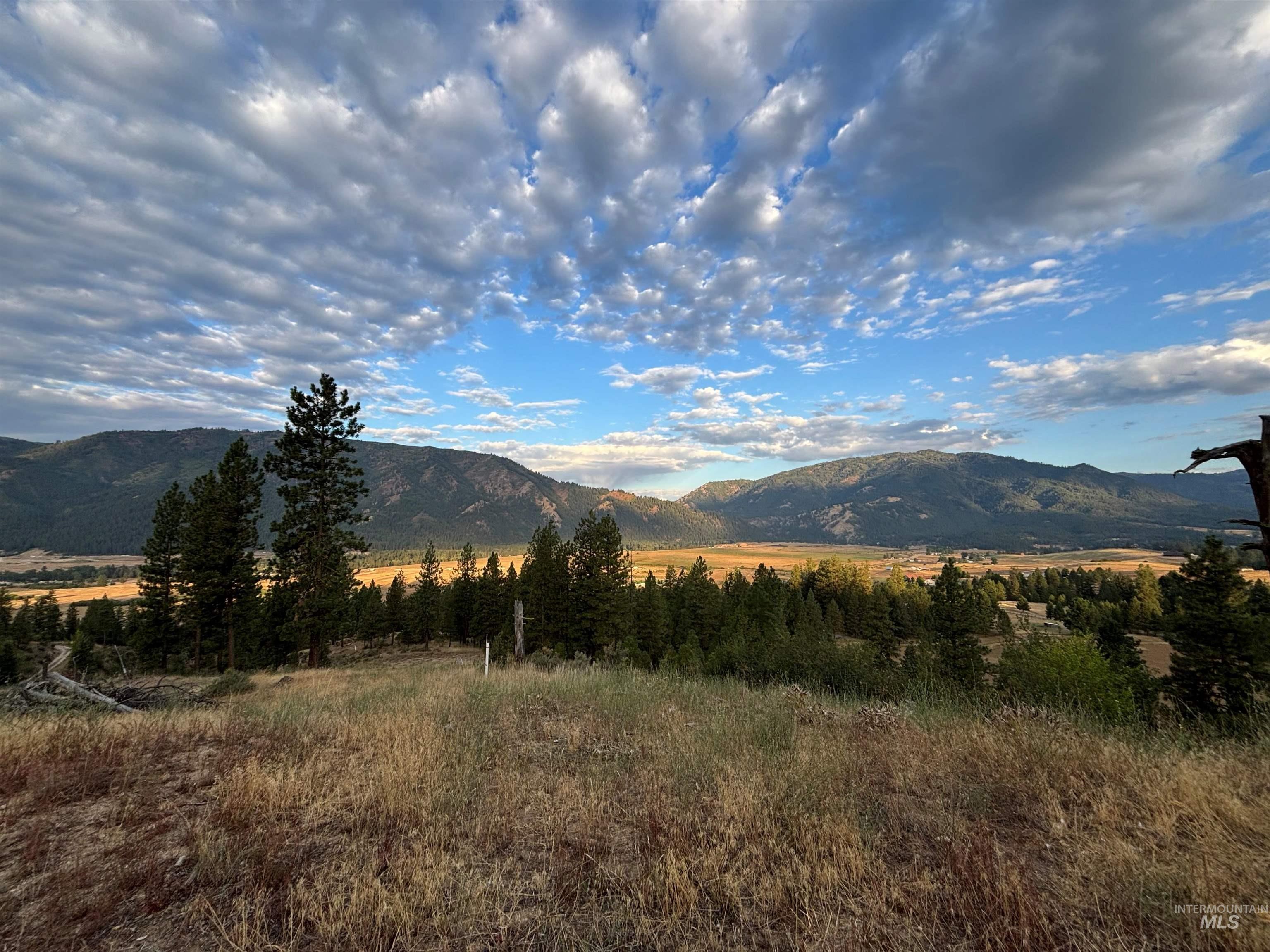 View of mountain backdrop featuring rural landscape