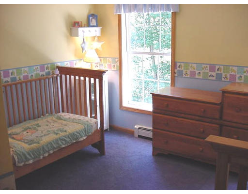 245 Benedict Road Burrillville, RI 02830 - Photo 18 of 25 a bedroom with a bed and window