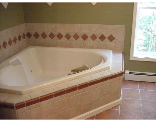 245 Benedict Road Burrillville, RI 02830 - Photo 22 of 25 a bathroom with a bathtub and a shower