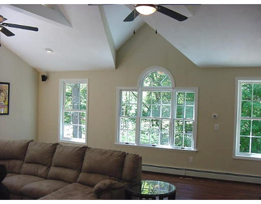 245 Benedict Road Burrillville, RI 02830 - Photo 25 of 25 a living room with furniture and a large window
