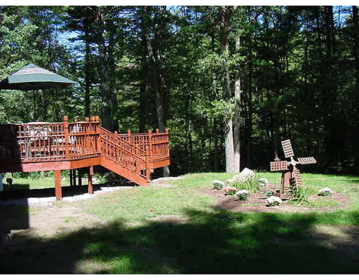 245 Benedict Road Burrillville, RI 02830 - Photo 8 of 25 a garden with trees in the background