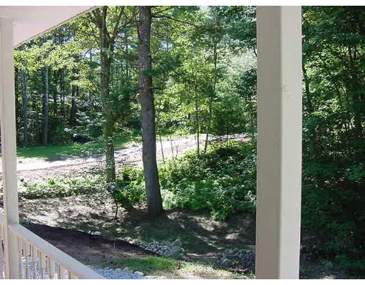 245 Benedict Road Burrillville, RI 02830 - Photo 9 of 25 a view of backyard with plants and outdoor seating