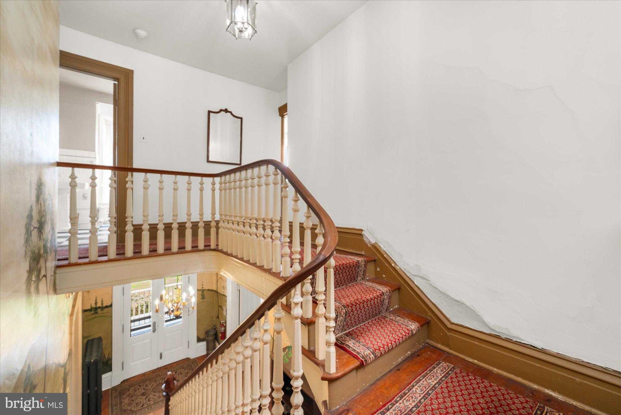 5358 York Road Doylestown, PA 18902 - Photo 18 of 61 a view of staircase with lots of frames on wall and a window