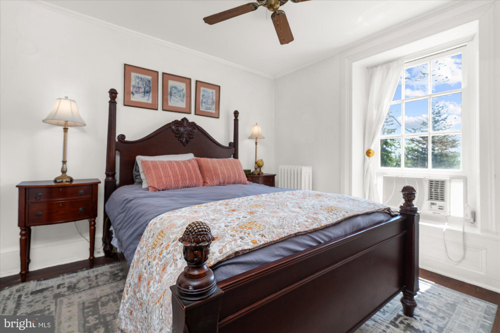 5358 York Road Doylestown, PA 18902 - Photo 24 of 61 a bedroom with a bed and a chandelier