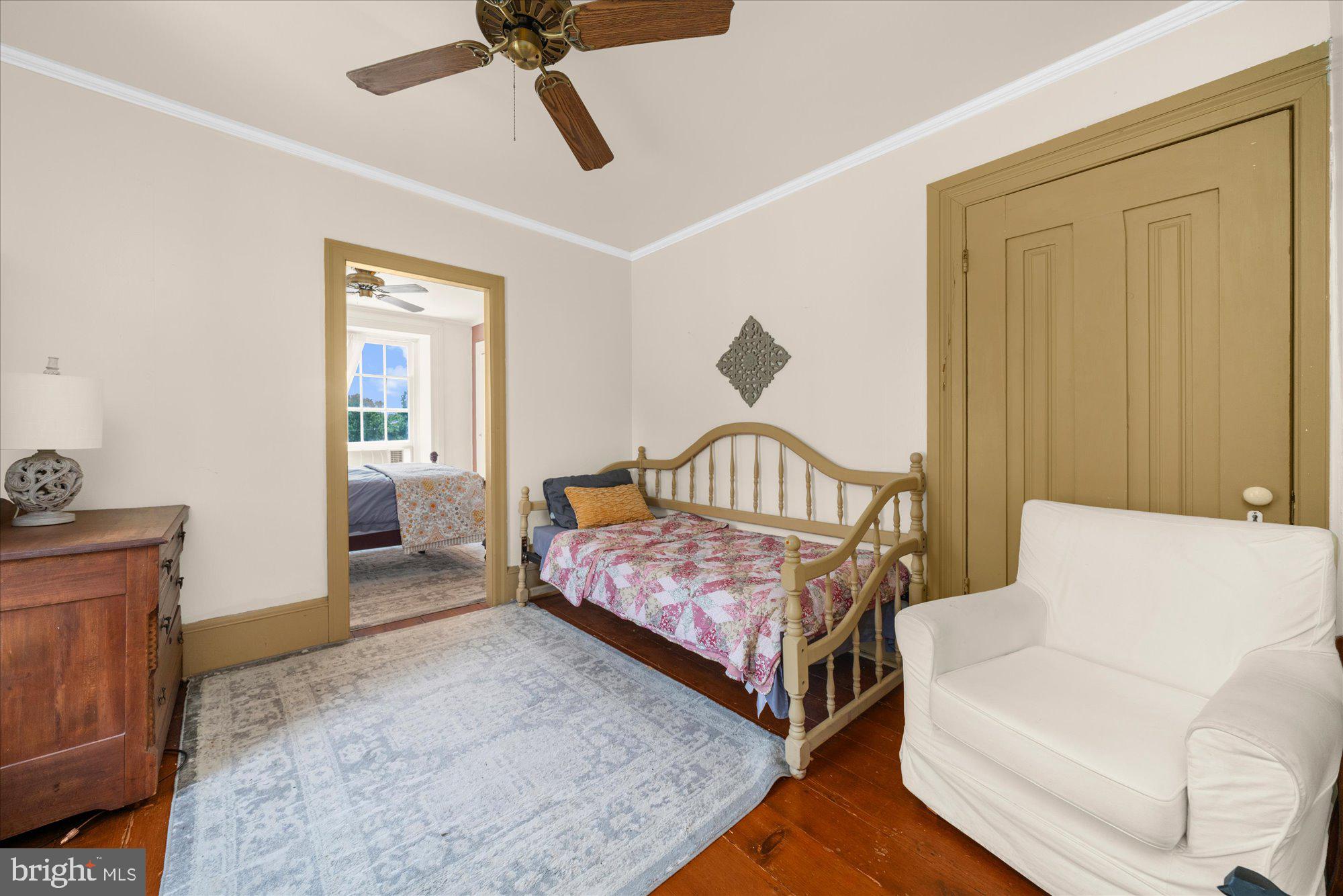 5358 York Road Doylestown, PA 18902 - Photo 25 of 61 a bedroom with a bed and a chandelier