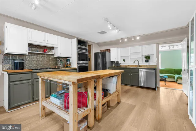 a utility room with dryer washer and other items