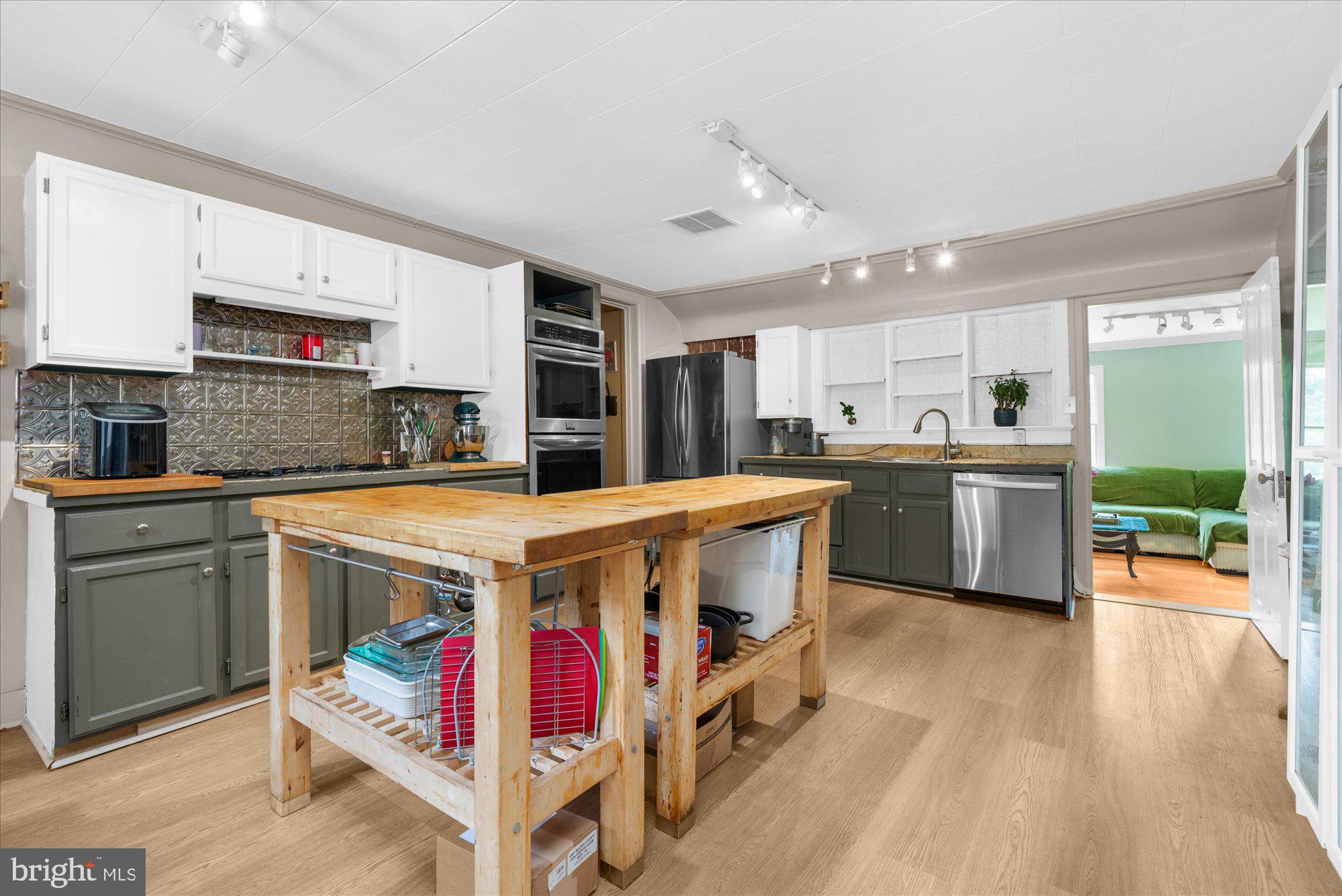 5358 York Road Doylestown, PA 18902 - Photo 30 of 61 a kitchen with stainless steel appliances granite countertop a sink a stove and a refrigerator