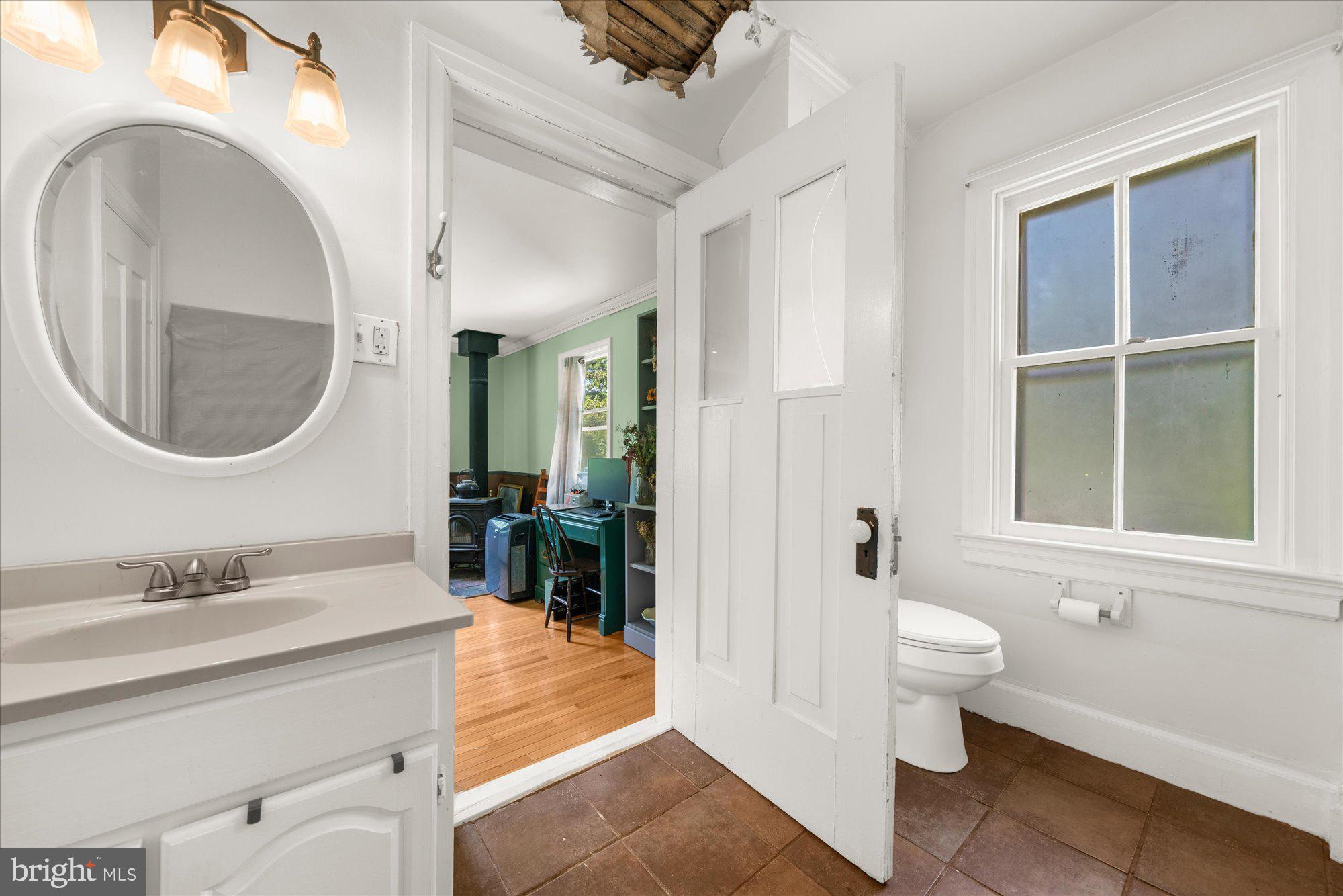 5358 York Road Doylestown, PA 18902 - Photo 33 of 61 a spacious bathroom with a toilet a sink and a mirror