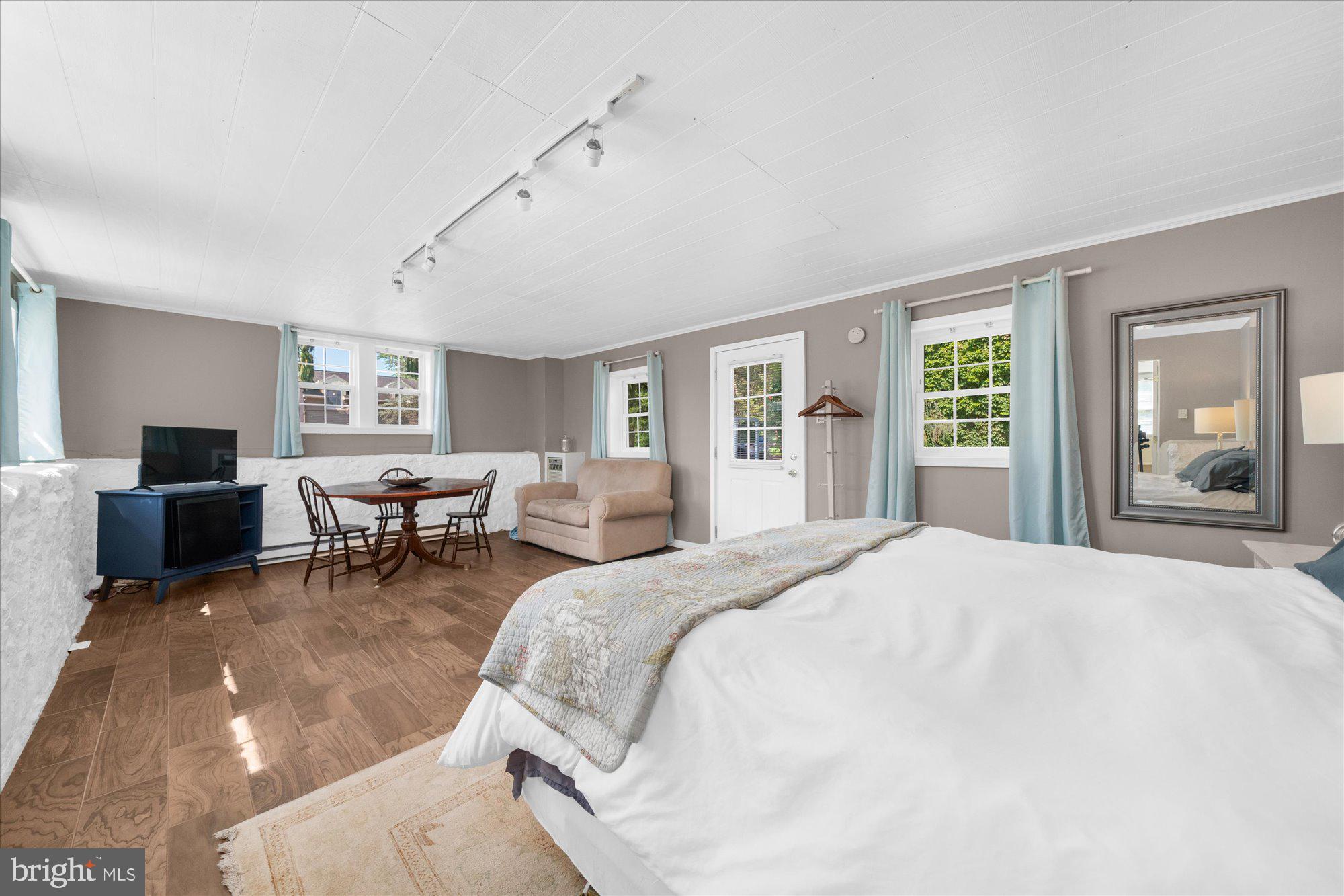 5358 York Road Doylestown, PA 18902 - Photo 43 of 61 a spacious bedroom with a bed and large windows