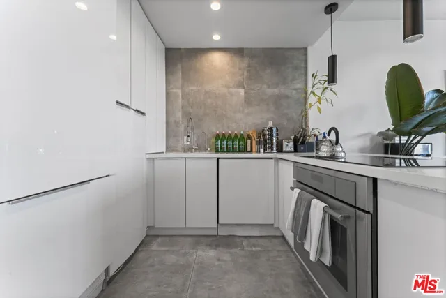 a kitchen with a sink a washer and dryer