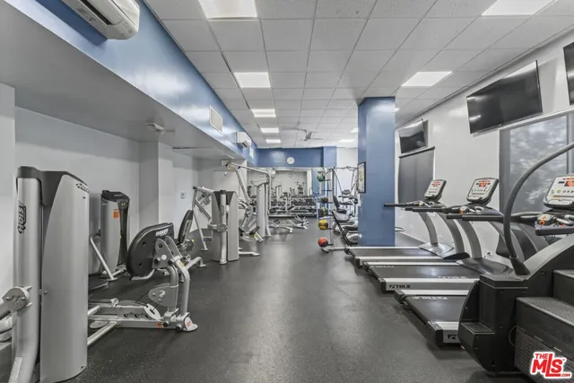 a view of a living room and kitchen