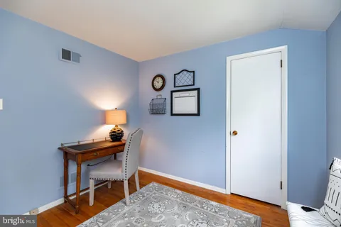 a room with a table and a window
